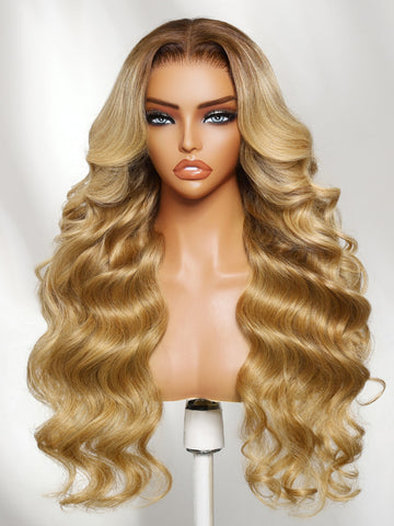 Klaiyi 7x5 No-Slip Glueless Lace Wig Warm Blonde with Brown Roots Voluminous Body Waves Invisi Drawstring & Face-Framing Layers