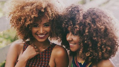 How do I distinguish real human hair wigs from synthetic ones?
