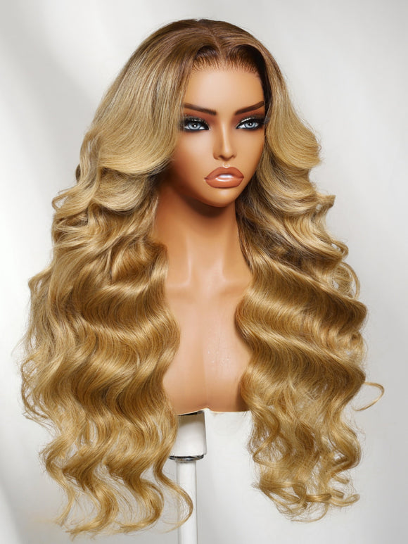 Klaiyi 7x5 No-Slip Glueless Lace Wig Warm Blonde with Brown Roots Voluminous Body Waves Invisi Drawstring & Face-Framing Layers
